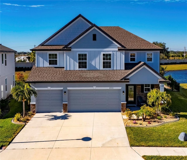 view of front facade with a garage and a front yard