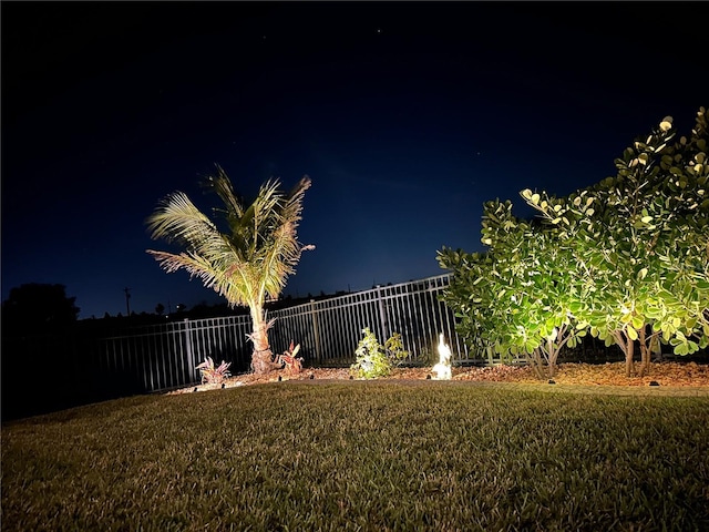 view of yard at twilight