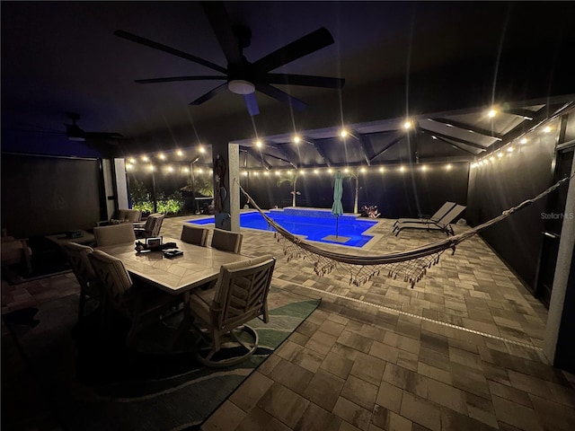 patio at night with ceiling fan