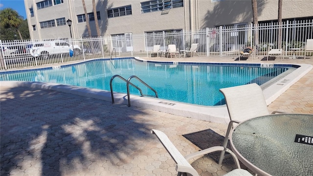 view of swimming pool featuring a patio