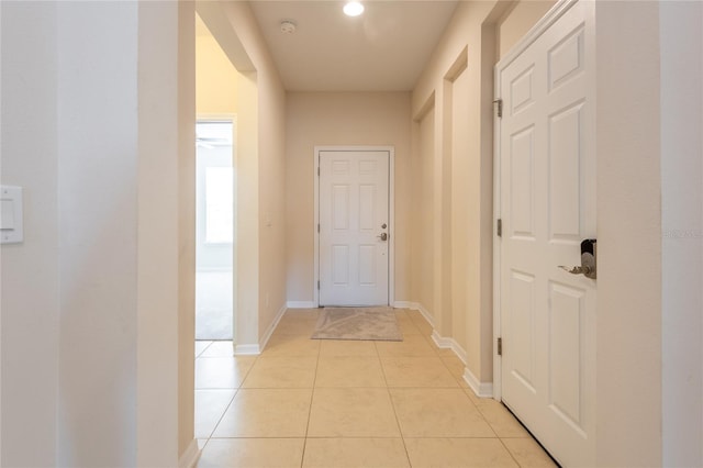 hallway featuring light tile patterned floors