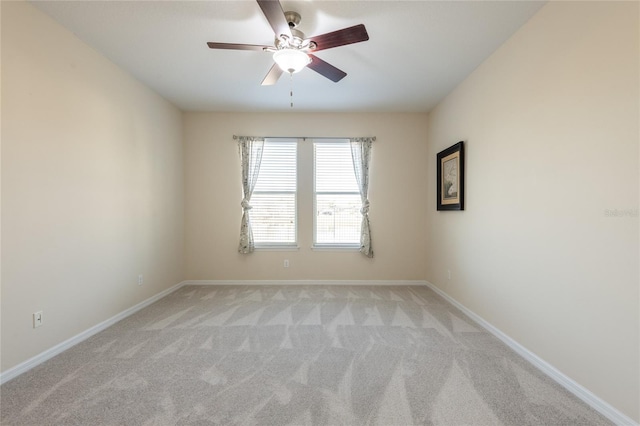 empty room with light carpet and ceiling fan