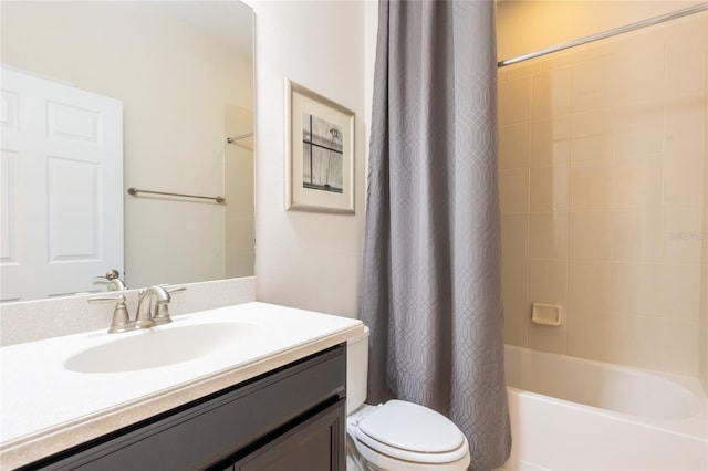 full bathroom with vanity, shower / tub combo, and toilet