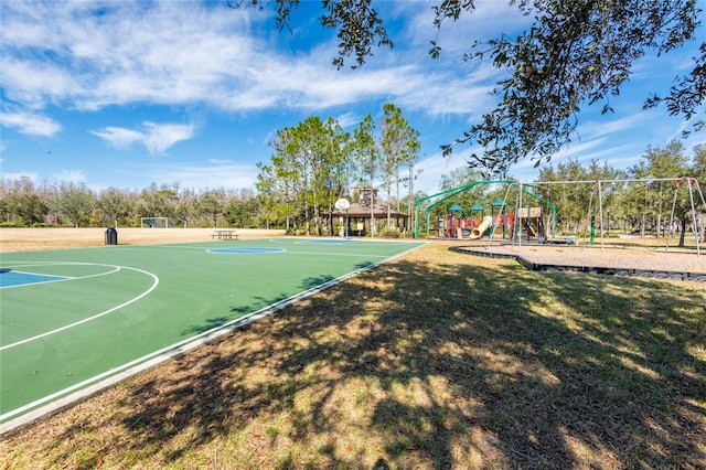 view of sport court with a playground