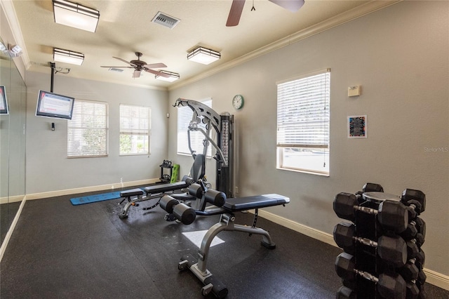 workout area featuring ornamental molding and ceiling fan