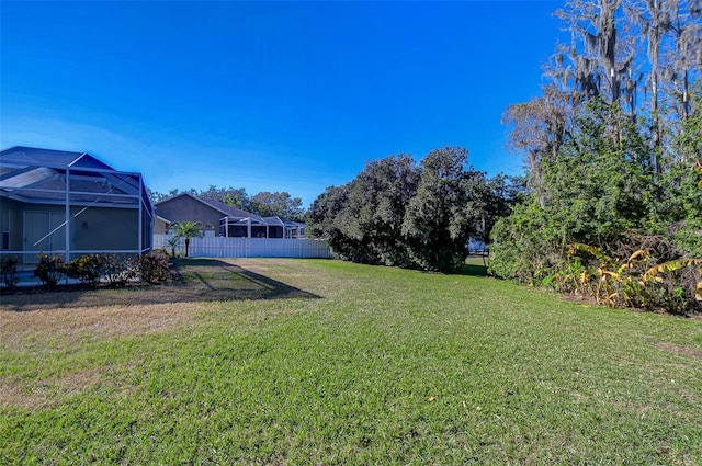 view of yard featuring a lanai