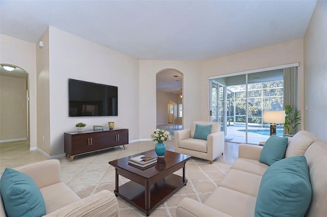 living room featuring a wealth of natural light and light tile patterned floors