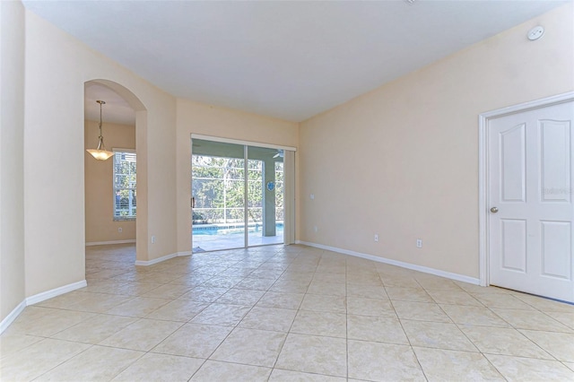 empty room with light tile patterned floors