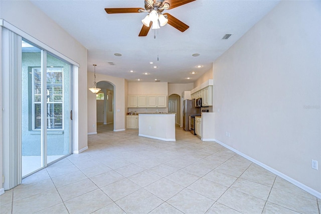 unfurnished living room with ceiling fan and light tile patterned floors