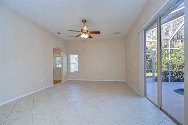 spare room with light tile patterned floors and ceiling fan