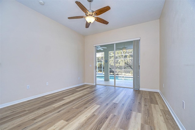 unfurnished room featuring ceiling fan and light wood-type flooring