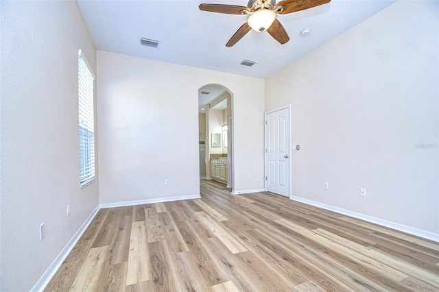 unfurnished room with ceiling fan and light hardwood / wood-style floors