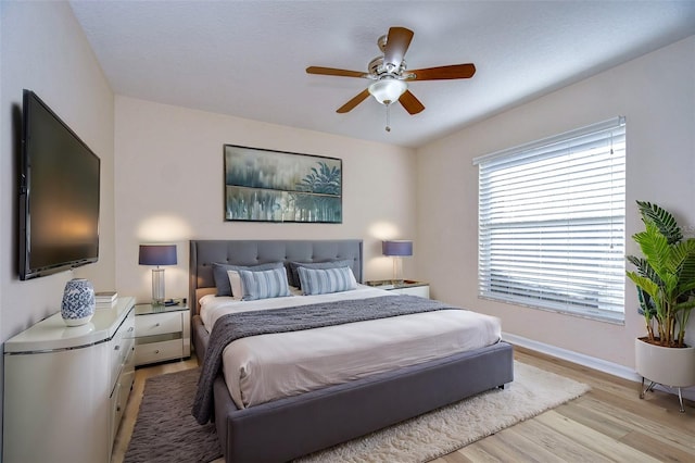 bedroom featuring ceiling fan and light wood-type flooring