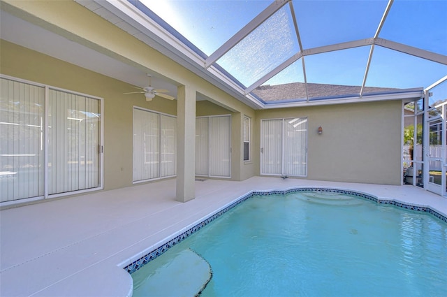 view of pool featuring ceiling fan, a lanai, and a patio