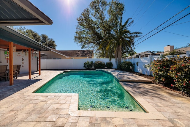 view of swimming pool with a patio