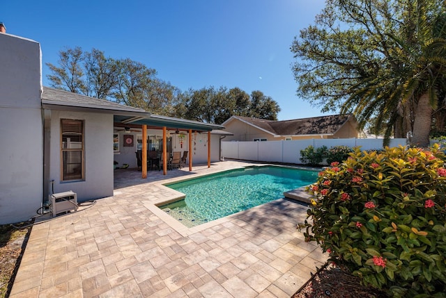 view of swimming pool featuring a patio area