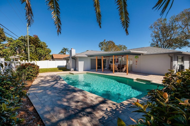 view of swimming pool with a patio