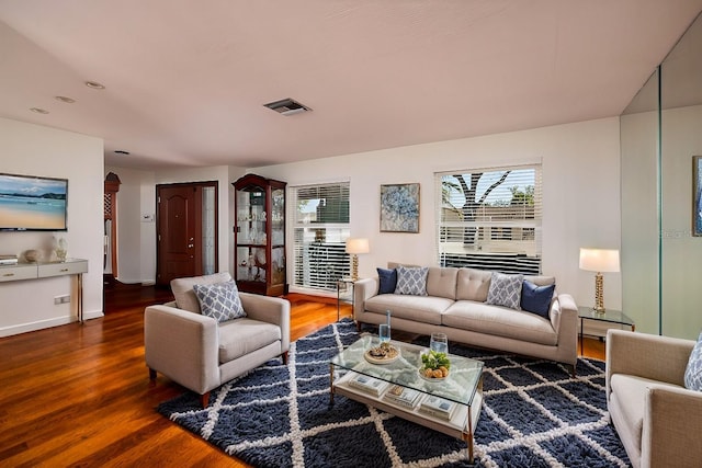 living room featuring dark hardwood / wood-style flooring