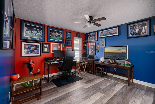 office area with hardwood / wood-style flooring, ceiling fan, and a textured ceiling