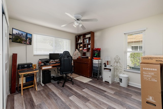 home office featuring wood-type flooring and ceiling fan