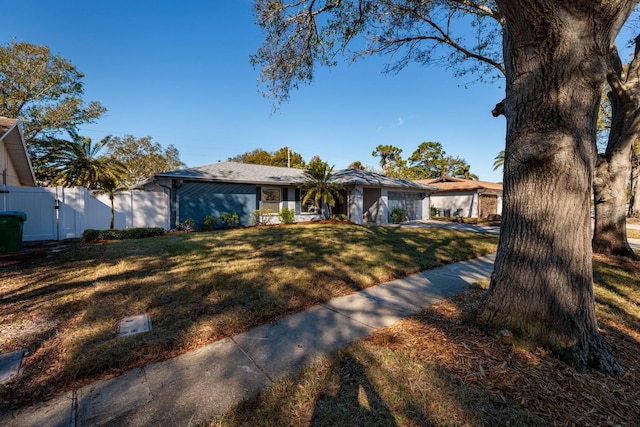 ranch-style house with a front yard