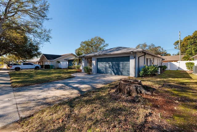 ranch-style home with a garage and a front yard