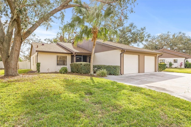 single story home with a garage and a front yard