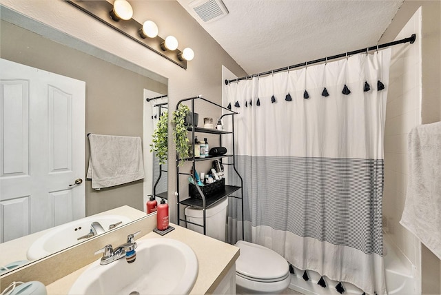 full bathroom featuring shower / tub combo, vanity, toilet, and a textured ceiling