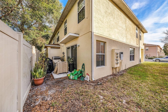 view of side of home featuring a lawn