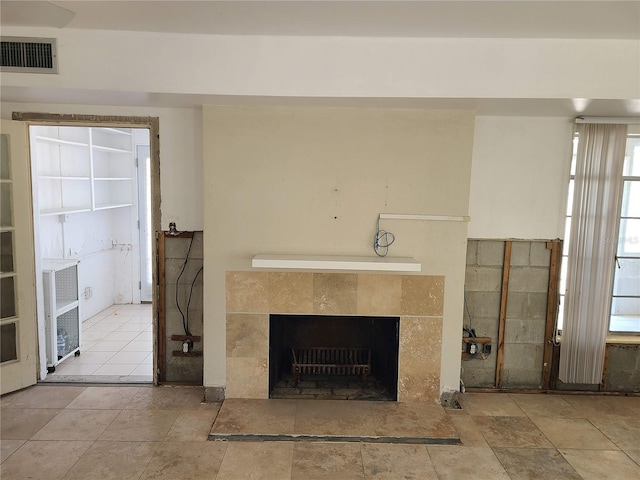 room details featuring a tiled fireplace