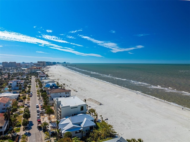 drone / aerial view with a water view and a beach view