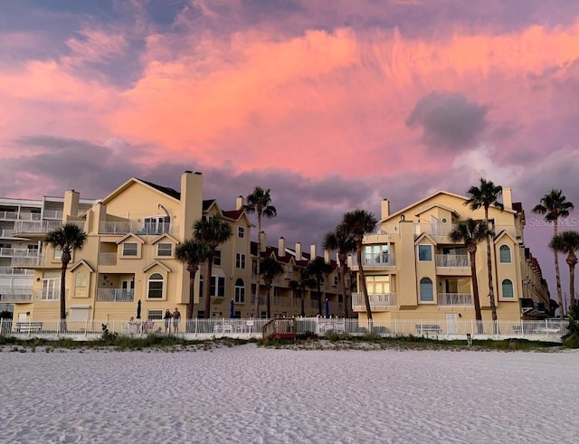 view of outdoor building at dusk