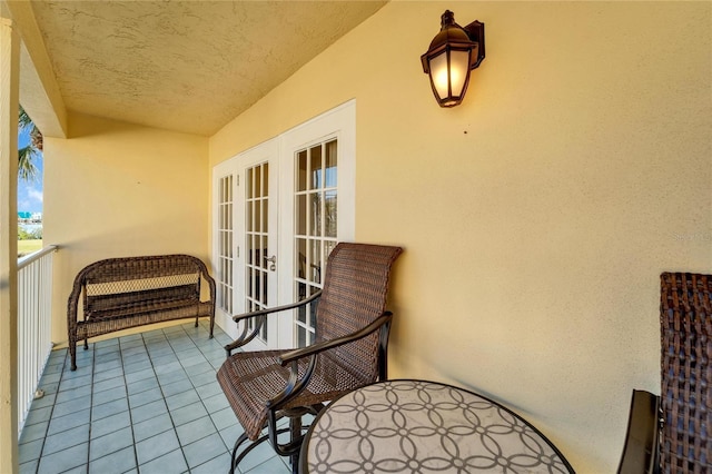 balcony featuring french doors