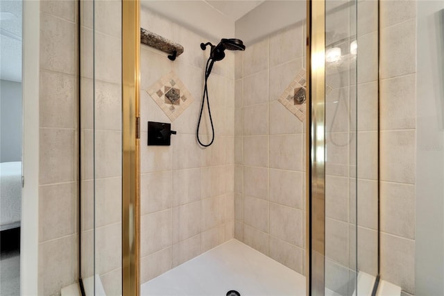 bathroom with a shower with shower door