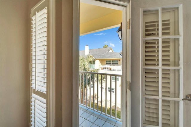 entryway with plenty of natural light and light tile patterned flooring