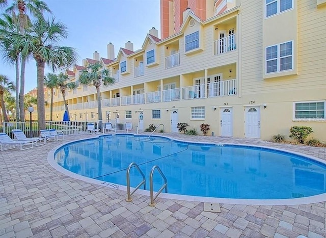 view of swimming pool with a patio area