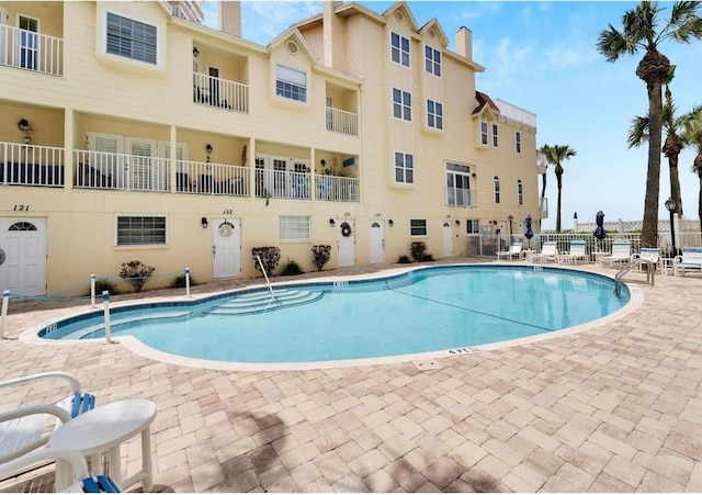 view of swimming pool featuring a patio