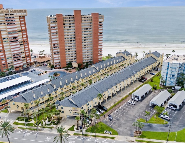 drone / aerial view with a water view and a view of the beach