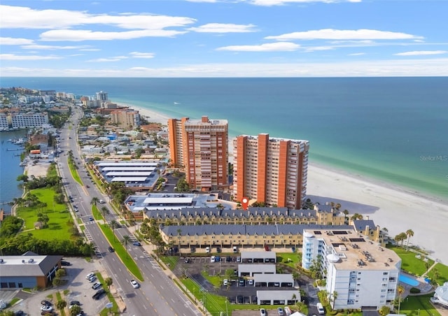 bird's eye view featuring a water view and a view of the beach