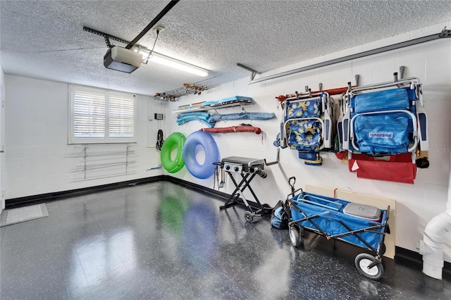 17960 Gulf Blvd Unit 103, Redington Shores, FL 33708 - garage with baseboards and a garage door opener