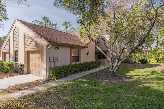 view of front of house with a garage and a front yard