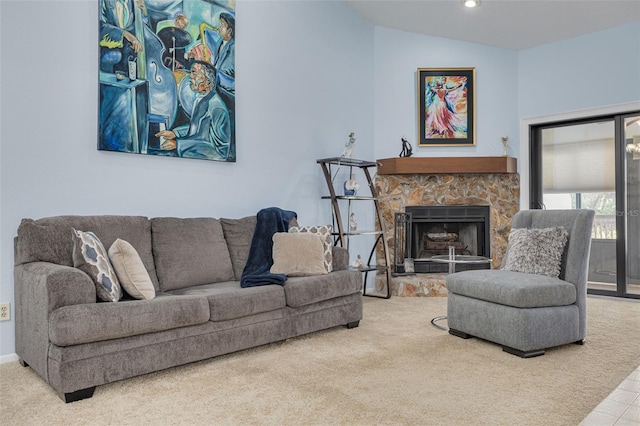 living room with lofted ceiling, a fireplace, and carpet floors