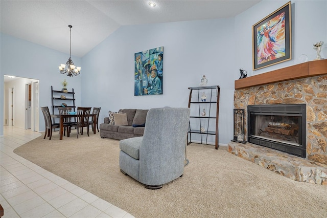 carpeted living room with an inviting chandelier, a stone fireplace, and high vaulted ceiling