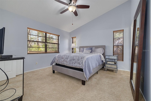 bedroom with vaulted ceiling, light carpet, and ceiling fan