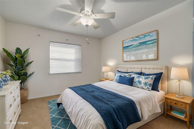 3985 Mermoor Dr, Palm Harbor, FL 34685 - bedroom with light colored carpet, baseboards, and ceiling fan