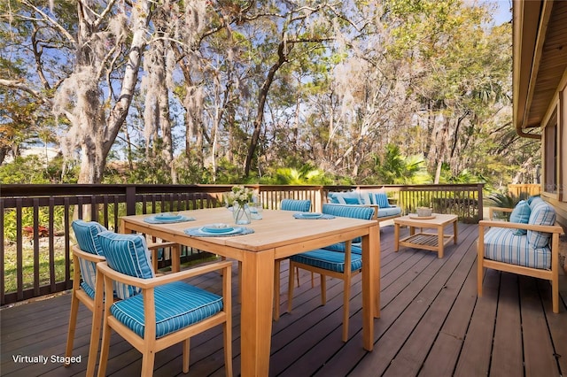 3985 Mermoor Dr, Palm Harbor, FL 34685 - wooden terrace with outdoor dining space and an outdoor living space