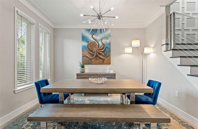 dining space with stairway, baseboards, ornamental molding, and a notable chandelier