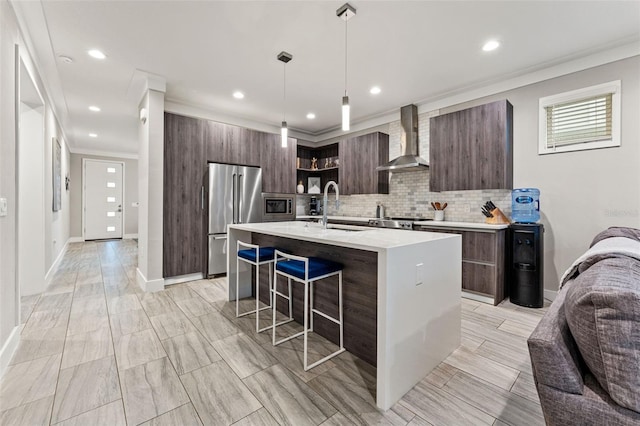 kitchen featuring open shelves, stainless steel appliances, light countertops, wall chimney exhaust hood, and modern cabinets