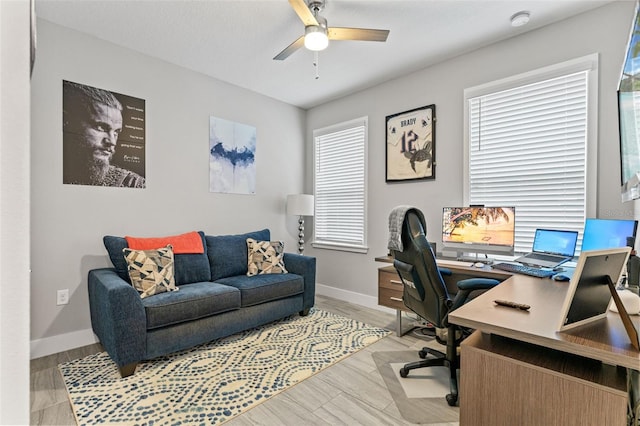 home office featuring ceiling fan, wood finished floors, and baseboards