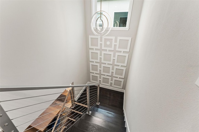 staircase featuring wood finished floors